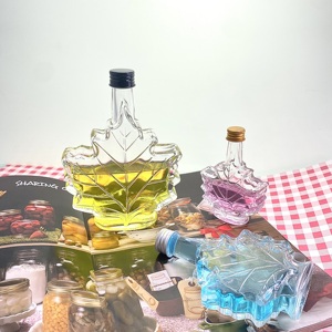 Bouteilles en verre uniques en forme <span class=keywords><strong>de</strong></span> feuille d'érable 50ml 100ml 250ml pour le stockage <span class=keywords><strong>de</strong></span> <span class=keywords><strong>rhum</strong></span> noir et <span class=keywords><strong>de</strong></span> boissons haut <span class=keywords><strong>de</strong></span> gamme - Product Image 3