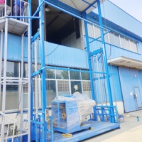 Plateforme élévatrice hydraulique personnalisée de 1 à 5 tonnes pour entrepôt, avec rails de guidage et deux plateformes de levage simples