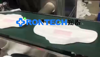 Machine de fabrication de serviettes hygiéniques jetables entièrement automatique pour femmes