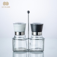 Ensemble de moulins à sel et à poivre de luxe avec support métallique, shaker à épices en verre, moulin manuel en céramique pour la vente en gros aux restaurants