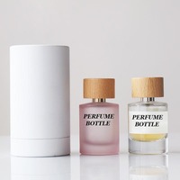 Flacon pulvérisateur de parfum rond cylindrique de 30ml 50ml 100ml personnalisé flacons de parfum en verre rose transparent à sertir vides avec boîte tubulaire