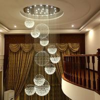 Lustre en cristal moderne K9 grand escalier de luxe suspendu E14 LED pour la décoration du hall d'hôtel Installation de projet en acier