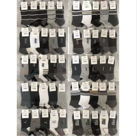 Chaussettes unies pas chères pour hommes et femmes, blanches et noires, pour usage quotidien, vente en gros pour les marchés de rue
