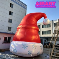 Seay a installé un chapeau de Noël gonflable avec logo personnalisé, imperméable, au prix d'usine.