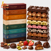 Vente en gros OEM/ODM de snacks au chocolat exotiques de haute qualité, chocolat au lait noisette et raisins secs