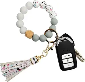 Bracelet porte-clés en silicone pour femmes Bracelet élastique perlé porte-clés porte-clés avec zircon et gland pour cadeau de fête des femmes