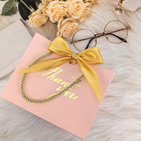 Sac cadeau de retour de fête prénatale réutilisable de boutique personnalisé Design décoratif avec nœud rose Votre propre logo en papier d'art