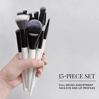 Ensemble de 15 pinceaux de maquillage, base noire, poils synthétiques à pointe blanche, ferrules en aluminium noir mat, manches peints en blanc