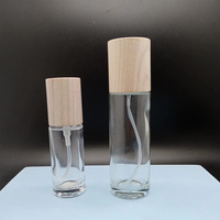 Botella de Vidrio Transparente para Cosméticos y Cuidado de la Piel con Tapa de Madera de Fresno y Pulverizador de Vidrio para Suero y Aceites