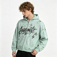 Sweat-shirt à capuche zippé épais vert menthe délavé à l'acide avec imprimé graffiti vieilli, style streetwear pour homme