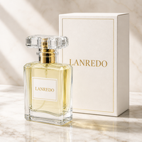 Flacon de parfum en verre carré facetté transparent de luxe 50ml 100ml avec bouchon en acrylique transparent, col doré et boîte cadeau blanche