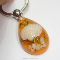 Porte-clés personnalisable en résine coquillage, coquillage artificiel, durable, souvenir touristique, vente en gros avec service de personnalisation du logo