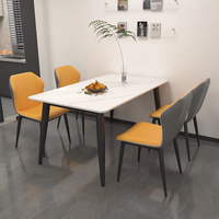XYBF Ensemble table à manger et chaises de restaurant au design moderne Table en pierre avec finition en marbre Chaise de salle à manger en cuir PU avec pieds en métal italien