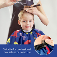 Cape de coupe pour enfants en gros Tablier de salon imprimé dinosaure imperméable pour barbier et usage domestique