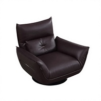 Fauteuil de salon moderne en cuir écologique, pivotant, avec structure en fer moulé sur mesure et pieds en acier carbone.