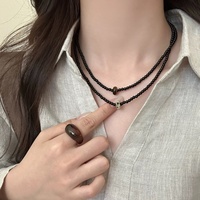 Collier élégant en perles d'abaque pour femmes, chaîne polyvalente en perles de verre noir pour clavicule