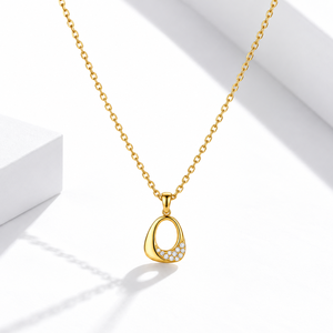 Collier asymétrique en forme de larme en acier inoxydable plaqué or 14 carats avec pierre transparente et pendentif ouvert - Product Image 1
