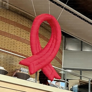 ริบบิ้นสีแดงเป่าลมขนาดใหญ่ รุ่นโบว์สีแดงเป่าลม พร้อมไฟ LED ส่องสว่างเพื่อสร้างความตระหนัก สำหรับแคมเปญสุขภาพ/กิจกรรมสาธารณะ/โปรโมชั่น - Product Image 1