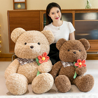 Vente en gros de jouets professionnels d'usine Ours en peluche 50cm 65cm 80cm 100cm Ours en peluche avec écharpe tenant des fleurs en peluche pour GI