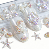Kit d'accessoires pour nail art 12 compartiments, motifs étoile de mer et coquillage, en alliage ; Bestseller transfrontalier, strass pour ongles effet aurore, coquillage et cocotier