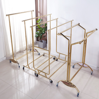 Porte-vêtements pliable télescopique sur pied réglable, support de séchage et de rangement en métal de luxe.