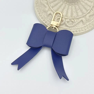Porte-clés et breloque de <span class=keywords><strong>sac</strong></span> à <span class=keywords><strong>main</strong></span> en cuir PU de luxe pour <span class=keywords><strong>femme</strong></span> avec nœud, porte-clés mignon de marque automobile pour cadeaux promotionnels d'affaires - Product Image 5