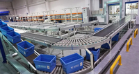 Système de convoyeur à rouleaux à gravité à chaîne automatisé industriel en acier inoxydable, vitesse de 20 m/min, dimensions personnalisables, assemblage