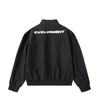 Blouson Bomber à Col Montant Zippé avec Poignets et Ourlet Côtelés, Poches à Rabat, Coupe Ample, Style Streetwear, Noir Uni, Vente en Gros Personnalisable