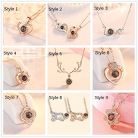 Collier en acier inoxydable personnalisé en métal 2026, 100 sortes de colliers en cuivre avec projection de la phrase « Je t'aime » en plusieurs langues, cadeau promotionnel
