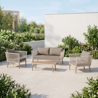 Ensemble de conversation extérieur 4 pièces en rotin PE moderne pour hôtel, canapé, chaise et table basse en osier résistant aux intempéries pour jardin
