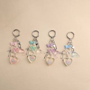 Porte-clés en alliage simple et élégant en forme de nœud, en résine tridimensionnelle en forme de cœur, pour téléphone portable ou sac - Product Image 6