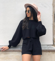 Ensemble décontracté deux pièces en maille unie avec haut court à lacets et manches longues, et pull court sexy