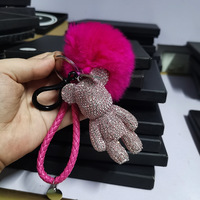 Offre Spéciale Mode De Luxe En Cuir Tressé Brin Plein Cristal Ours Pendentif Porte-clés Moelleux Pompon Porte-clés