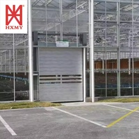 Rideau industriel à ouverture latérale électrique à grande vitesse en polymère plastique et aluminium, design moderne, étanche et résistant au vent