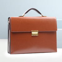 Mallette en cuir véritable pour hommes avec sangle de verrouillage par mot de passe Sac à main de bureau de grande capacité pour ordinateur portable et documents Sac de luxe