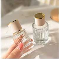 Bouteilles de parfum en verre en forme de cylindre de 30ml 50ml 100ml flacons vaporisateurs de parfum vides transparents et contenants d'huiles essentielles rechargeables