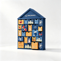Boîte en papier personnalisée pour calendrier de l'avent avec matériaux écologiques, 24 compartiments numérotés et design en forme de maison