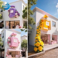 Production de sculptures de bouteilles de parfum en fibre de verre et plastique à grande échelle comme accessoires d'affichage commercial