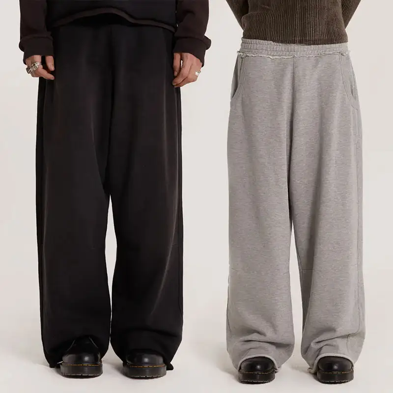 Pantalones de chándal de peso pesado de gran tamaño personalizados de fábrica OEM de Huilin, pantalones de chándal para correr relajados con cintura elástica y dobladillo crudo de Color sólido para hombre
