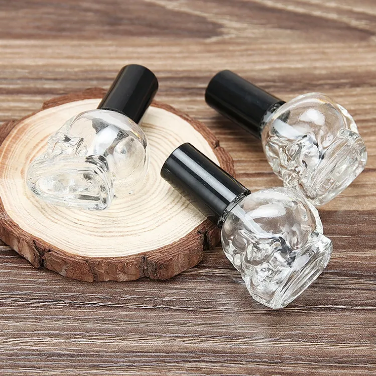 Luxury empty skull shape 10ml glass nail polish bottles clear nail polish bottle packaging with brush