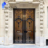 Porte d'entrée élégante en fer forgé noir avec motif de verre en croix pour résidence contemporaine