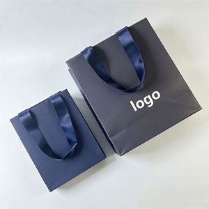 Customized Promotional Navy Blue <b>Paper</b> Gift Bag With Satin Handle Ideal for Fashion, Clothing & Jewelry Packaging - Product Image 1