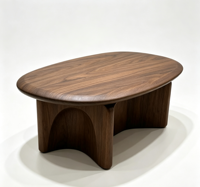Table basse ovale en noyer de style mid-century, base sculpturale à découpe cintrée, table centrale minimaliste en bois massif pour salon