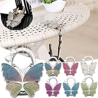 Individuelles Logo Tragbarer Faltbarer Glitzernder Taschenhalter Schmetterling-Taschenhaken Handtaschenhaken für Tisch und Schreibtisch