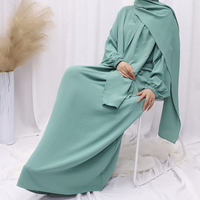 2024 Vente en Gros Nouveau Style Abaya Élégante Dubaï Modeste Jilbab pour Femmes Musulmanes Robe Longue Couleur Unie Tendance avec Hijab