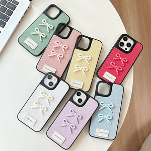 Nuova <span class=keywords><strong>Cover</strong></span> Minimalista in Pelle con Fiocco a Pois 3D Macaron Tinta Unita per <span class=keywords><strong>iPhone</strong></span> 17 16 15 14 <span class=keywords><strong>13</strong></span> <span class=keywords><strong>Pro</strong></span> <span class=keywords><strong>Max</strong></span> con Bordo Nero - Product Image 1