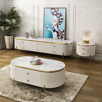 Ensemble de meubles de salon de luxe moderne avec table basse et meuble TV en marbre blanc et pieds en acier inoxydable doré, avec tiroirs, pour hôtel