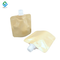 Pochettes souples vides OEM en plastique pour soins de la peau, avec bec verseur, en papier kraft, à fond plat, pour liquides cosmétiques