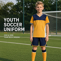 Tenue de football personnalisée pour jeunes : Maillot à manches courtes et short à rayures verticales et blocs de couleur pour l'entraînement quotidien des équipes de football pour enfants