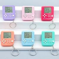 Vente en gros de jouets en plastique : Porte-clés et pendentifs consoles de jeux classiques, petites machines cube rétro et jouets éducatifs